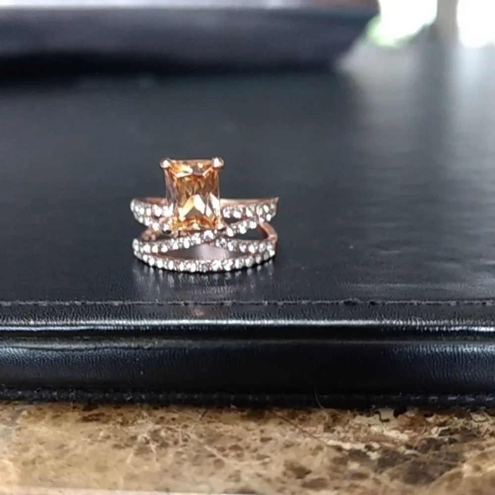 Rose gold colored ring with champagne stone Size 6